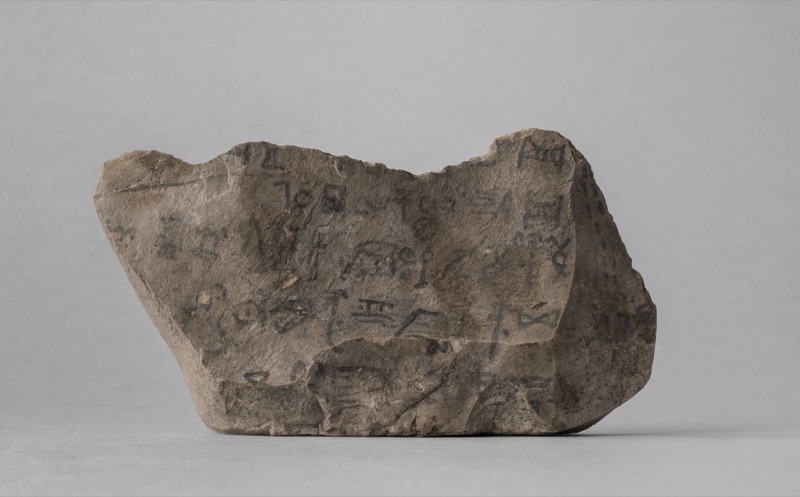 Limestone ostracon carrying lines of hieratic ink